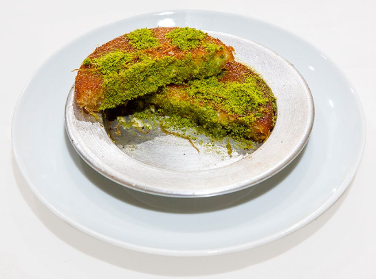 With clotted cream and pistachio
