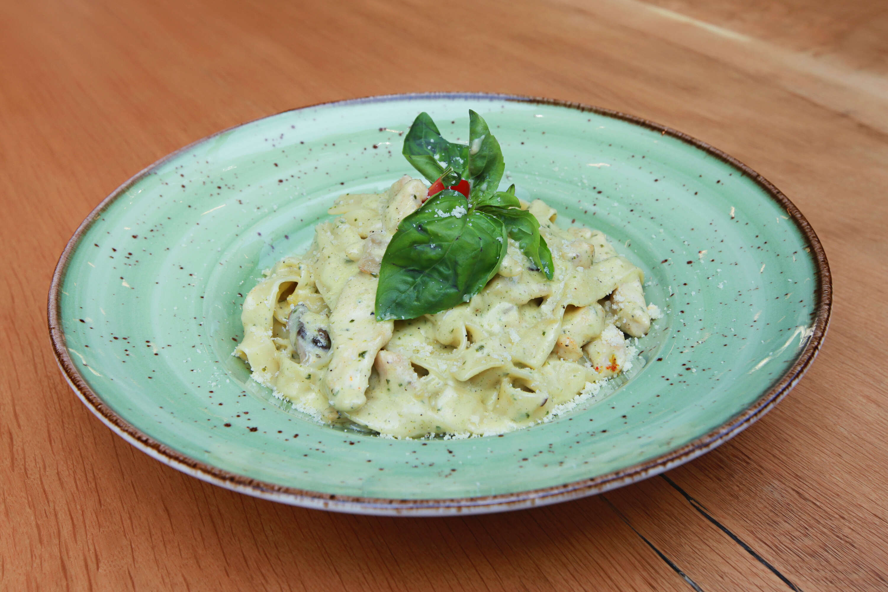 Fettuccine Alfredo with chicken, pesto and cream