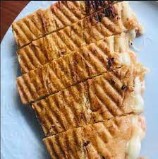 Three-cheese half-bread sandwich