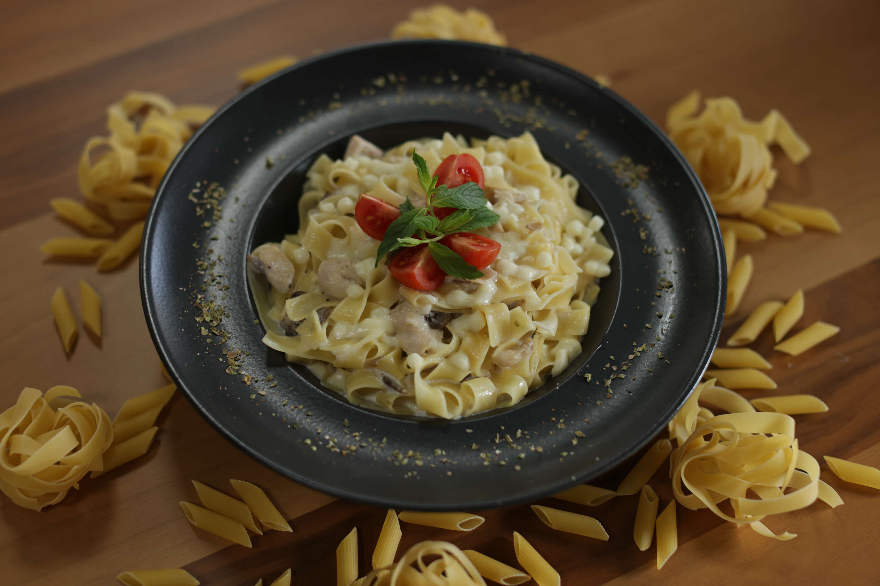 Fettuccine Alfredo with creamy mushroom chicken and mozzarella