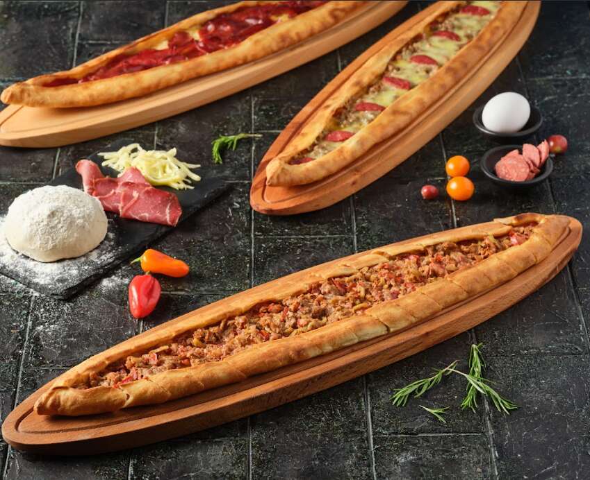 Open pide with diced meat