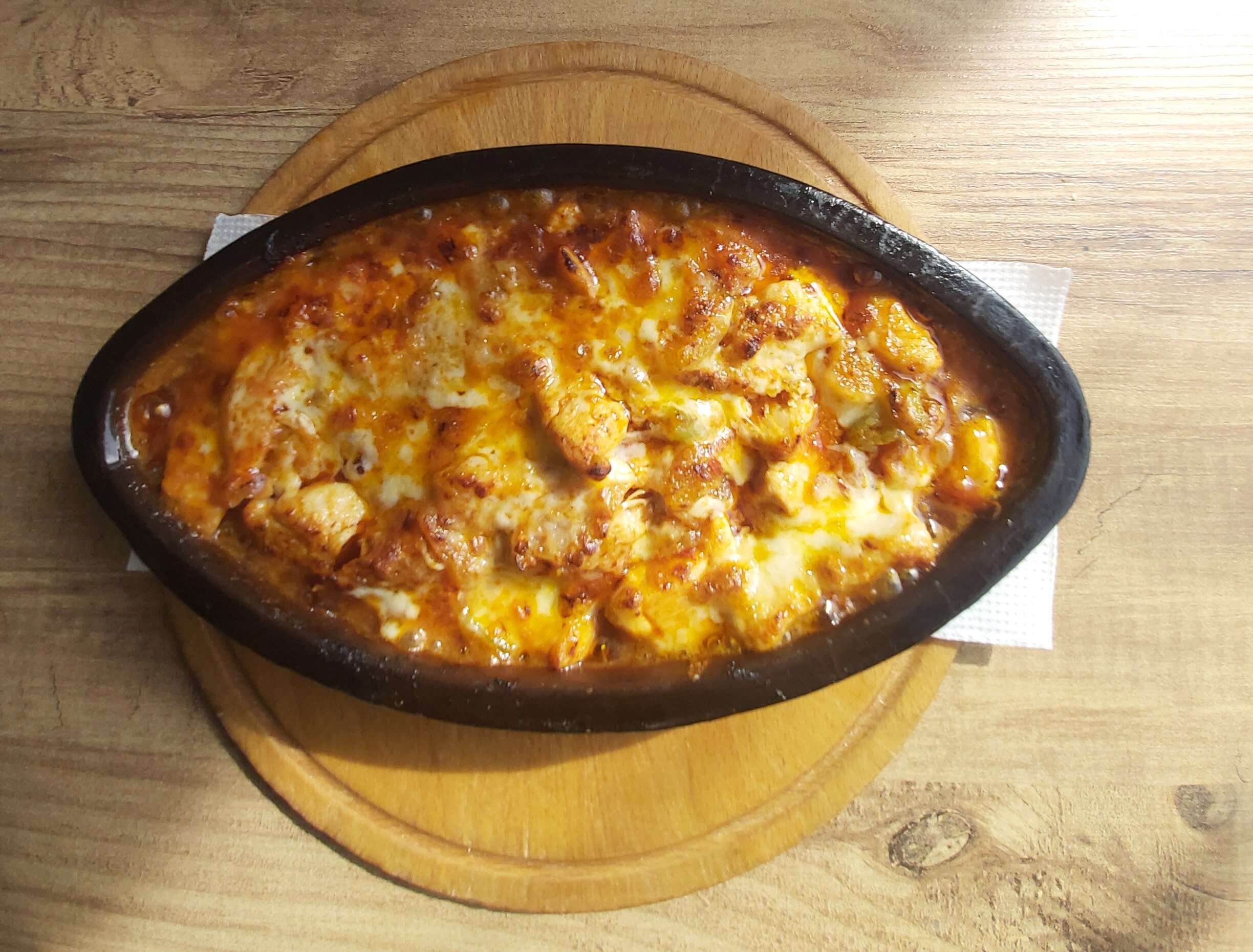 Chicken baked in a clay dish