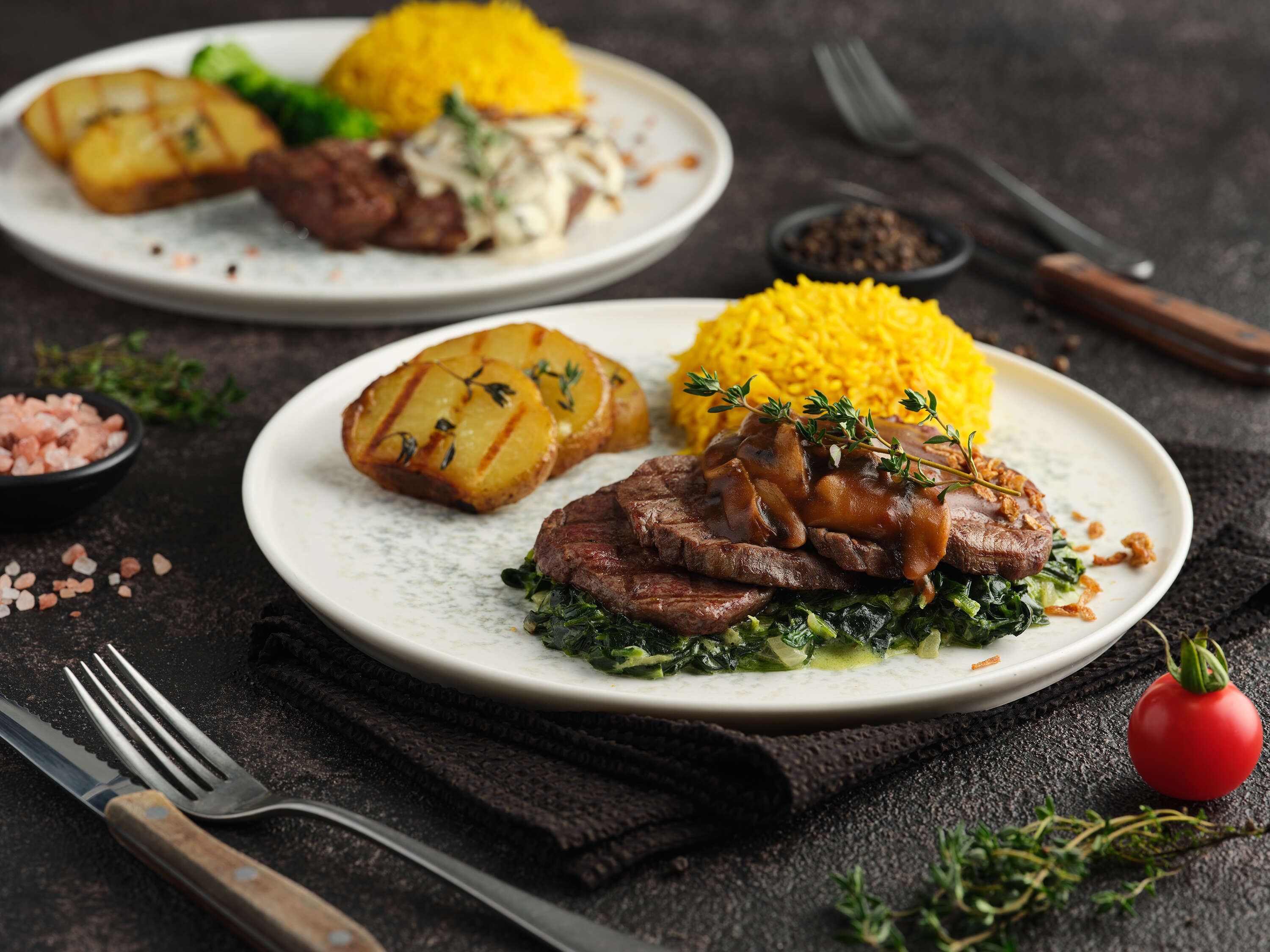 Beef tenderloin with demi-glace sauce on a bed of spinach