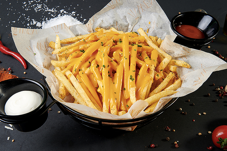 Extra-crispy fries with cheddar sauce