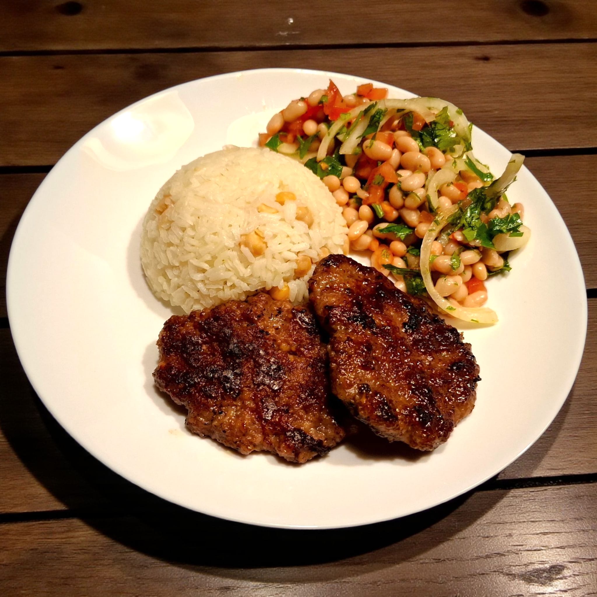 Turkish beef kofta with rice and beansalad (piyaz) 
