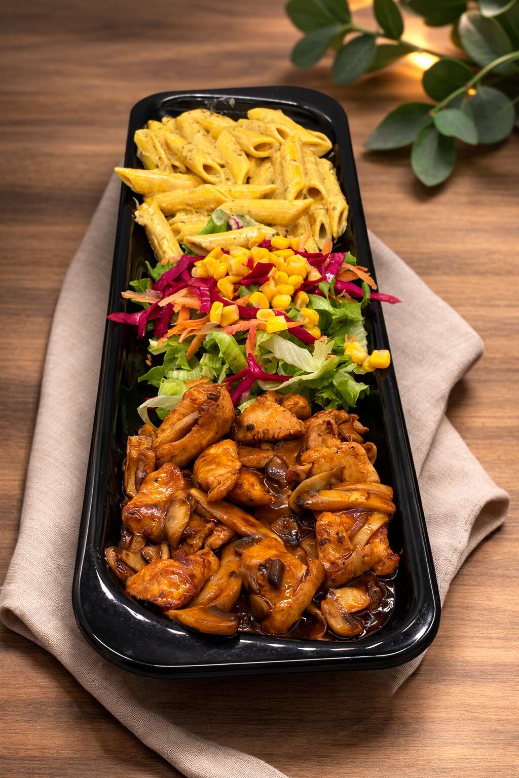 Spicy sauced chicken with pesto pasta and salad