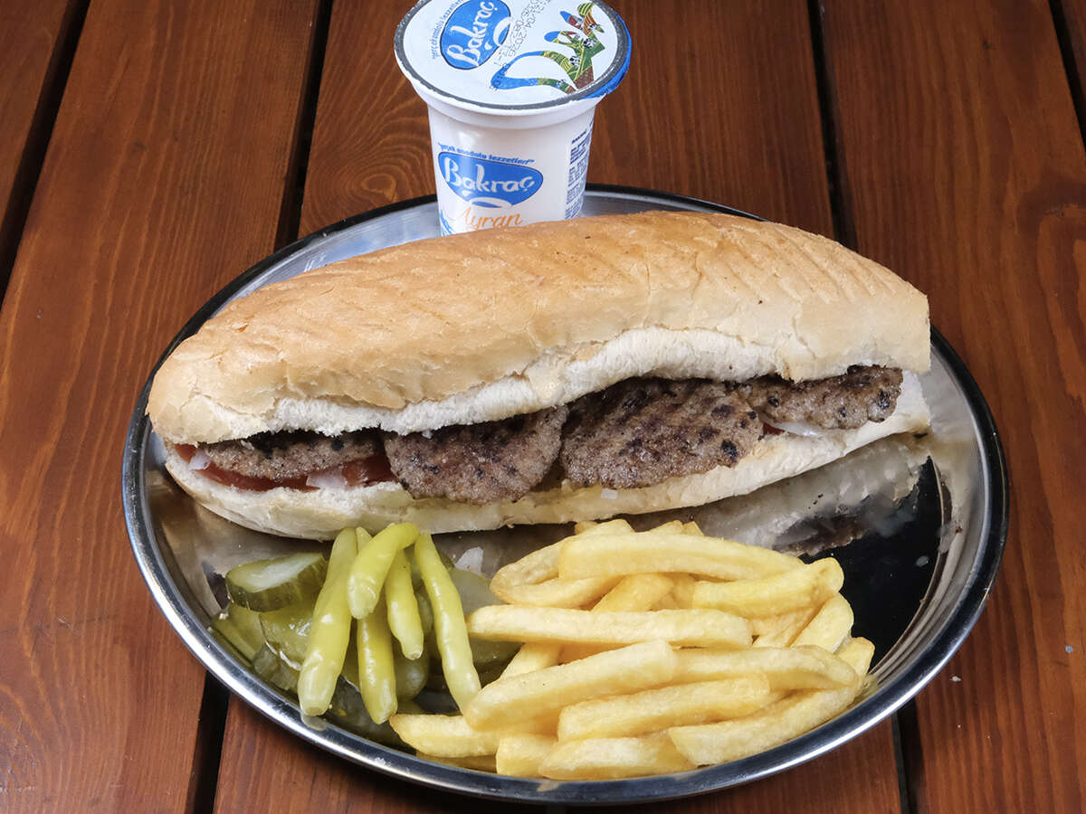 Köfte sandwich with ayran and fries