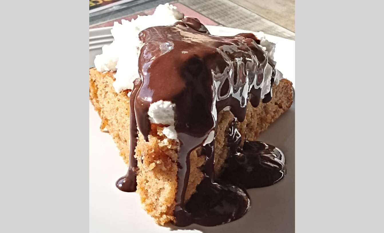 Gluten-free chocolate cake with whipped cream