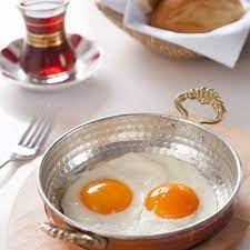 Butter-fried sunny-side-up eggs