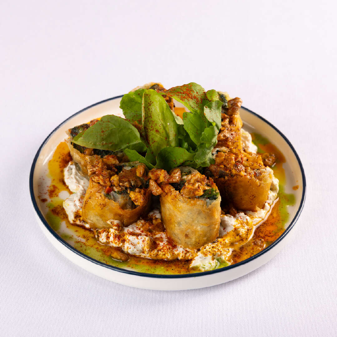 Spinach-wrapped sea bass
